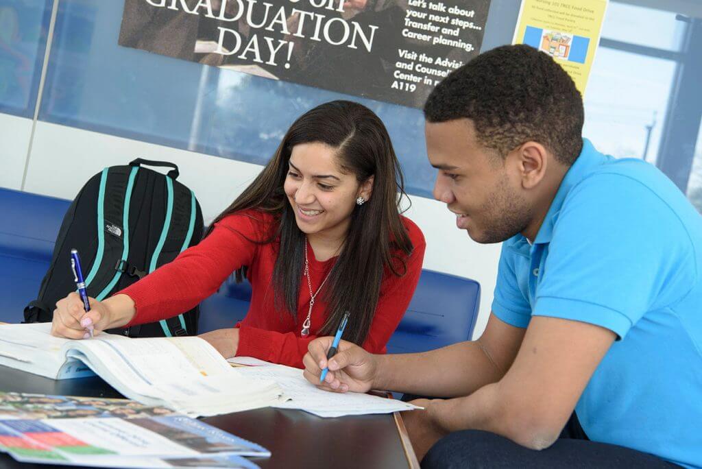 Two students studying together at a table