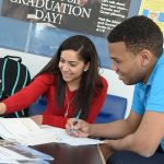 Two students studying together at a table