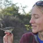 picture of corrie folsom okeefe holding a bird